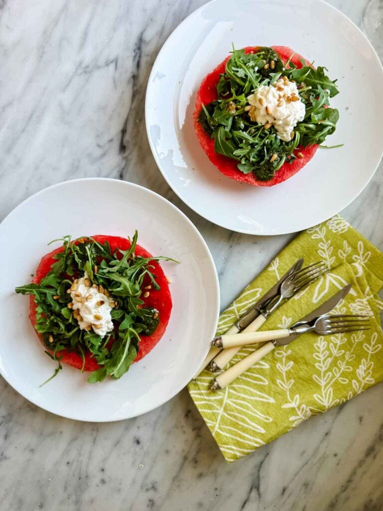 This is our version of Odeon's watermelon and arugula salad served with stracciatella, pine nuts and pesto.