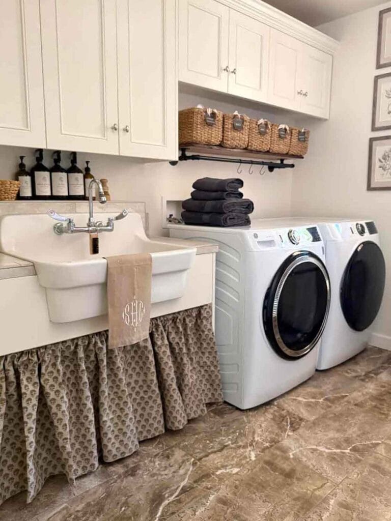 Laundry room with farm sink, cafe curtain.