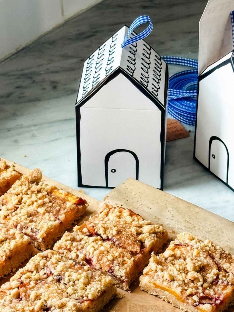 Brown butter shortbread bars have been cut and are ready to be placed in the boxes for gifting.