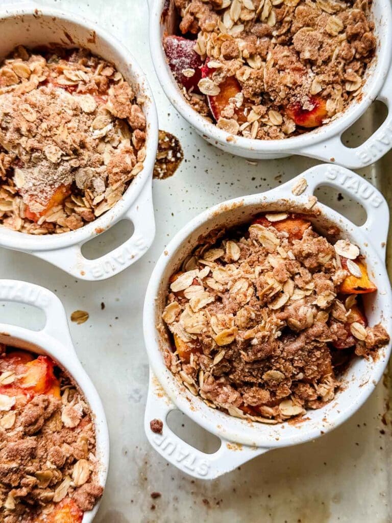 Peach crisp in Staub cocottes. 