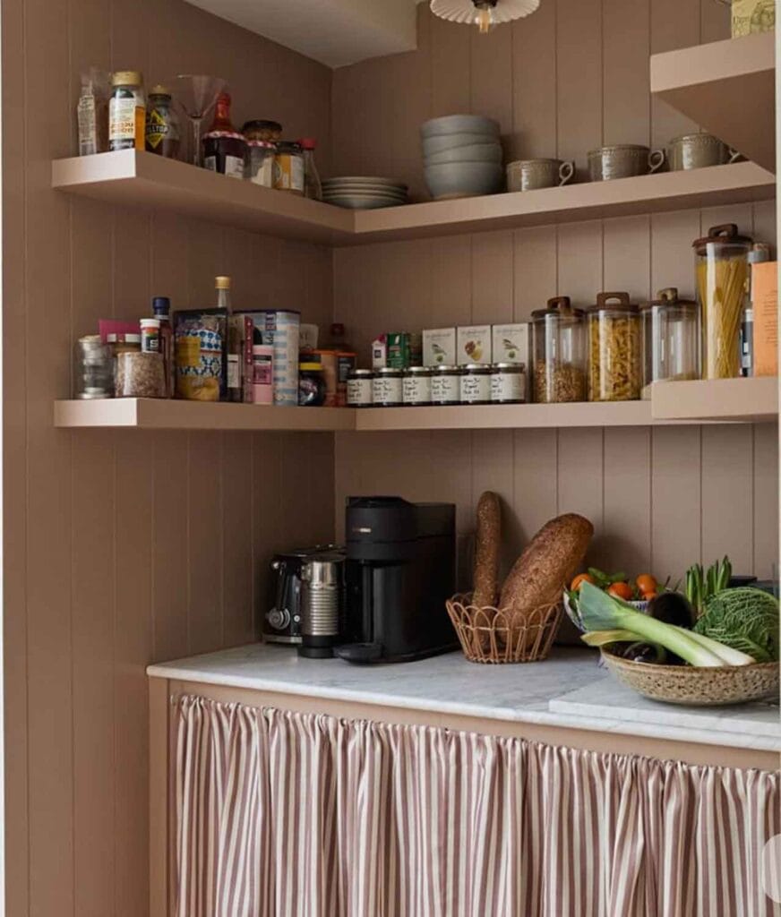 Cafe curtain in a pantry with open shelving.