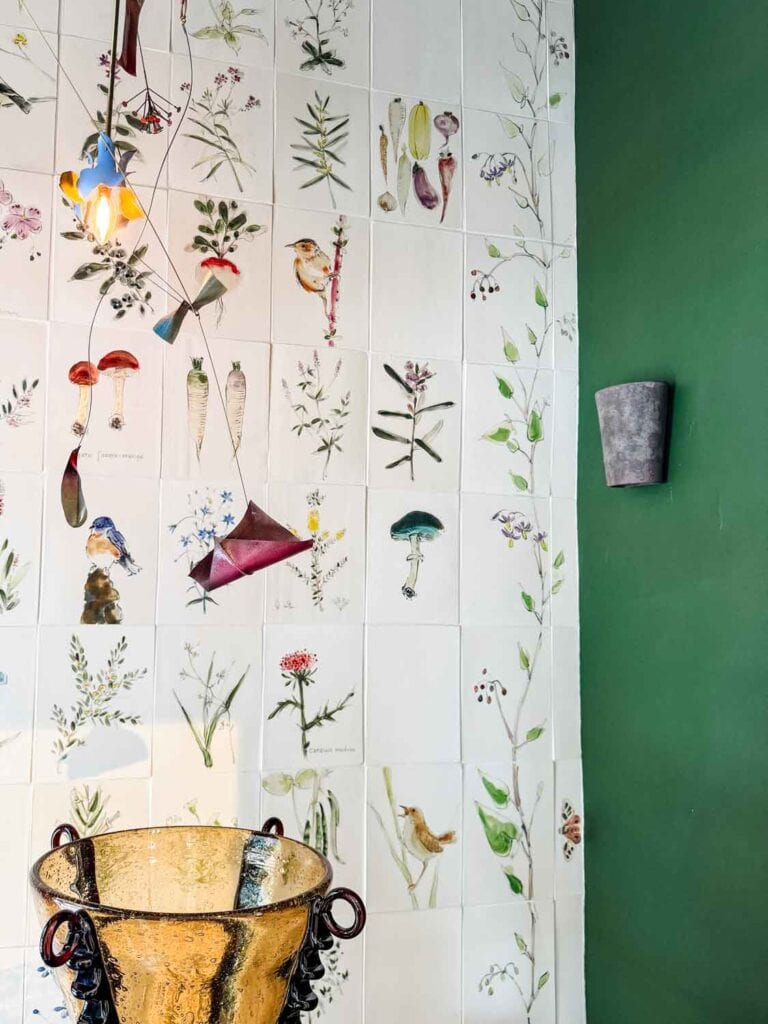 Hand painted tiles, green wall.