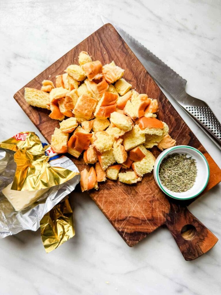 Cubes of brioche bread, salted butter, small dish of herbs de Provence.
