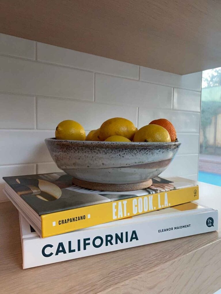 California cookbooks with cermaic bowl of citrus.