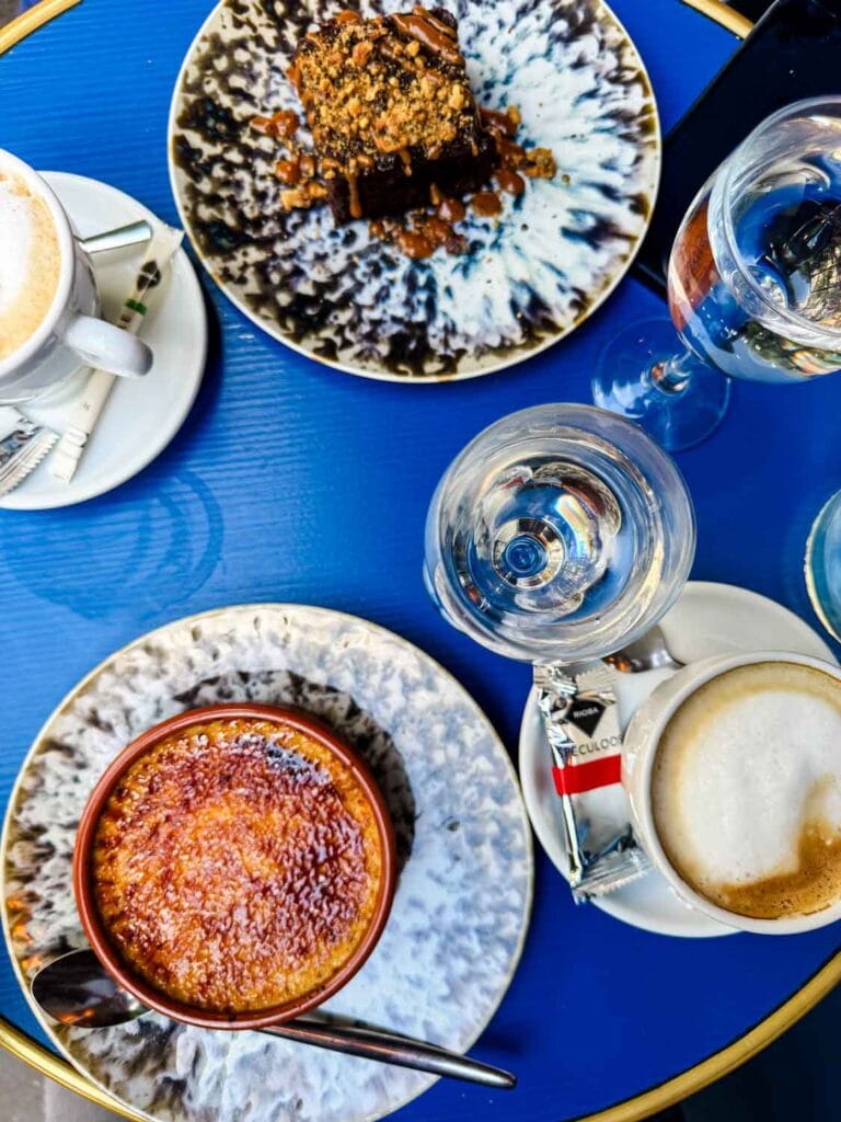 Chocolate fondant and hazelnut crème brûlée are served with cappuccinos at the French bistro Les Rupins in Paris.