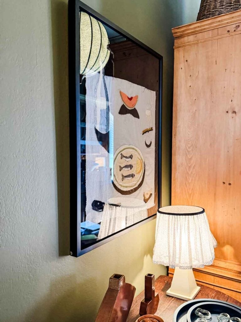 Art on wall, small lamp.