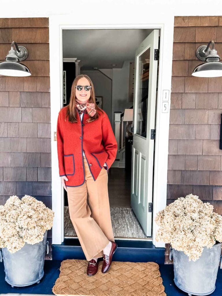 Annie Diamond wearing the Cambridge jacket from Alex Mill inn a doorway.