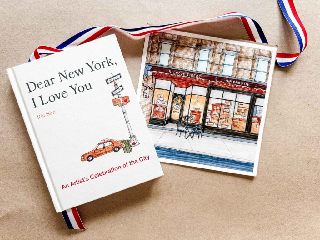Dear New York, I Love You book with red white and blue stripe ribbon, and art of Via Carota on brown kraft paper background.