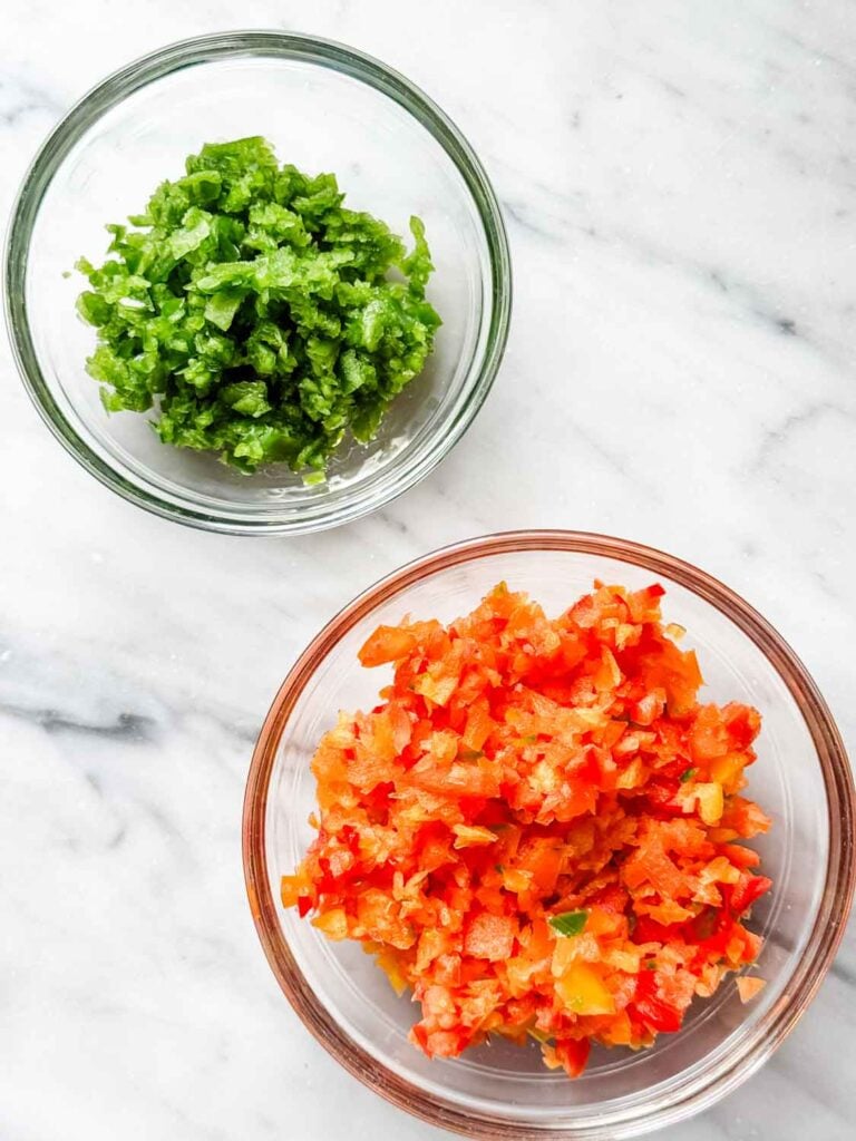 Glass bowls of jalapeños, and bell peppers.