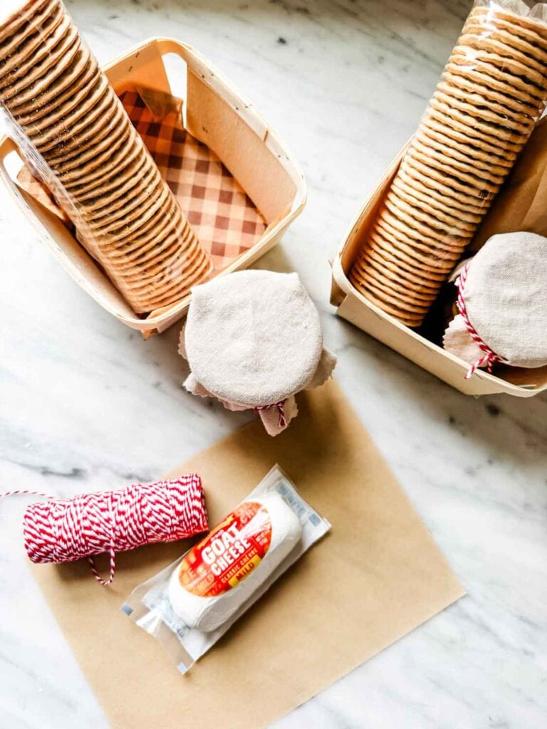 Wooden berry crates, goat cheese, jars with fabric jar toppers tioed up with twine.